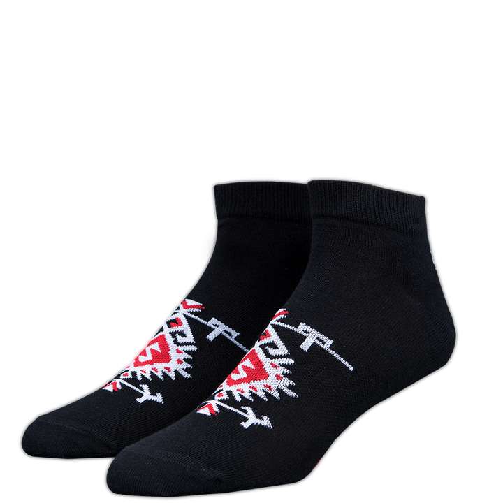Black socks with red and white designs on a white background