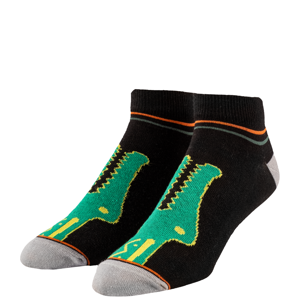 Black socks with green and yellow designs on a white background
