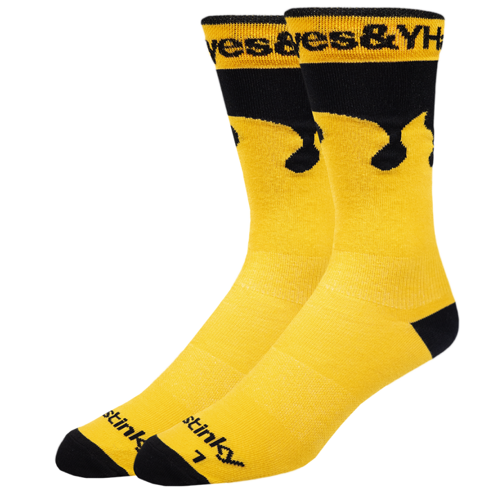 Yellow socks with black accents and visible branding on a white background