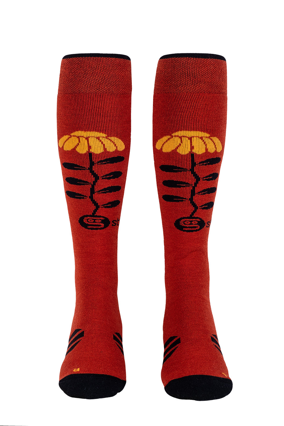 Red knee-high socks with yellow and black designs on a white background