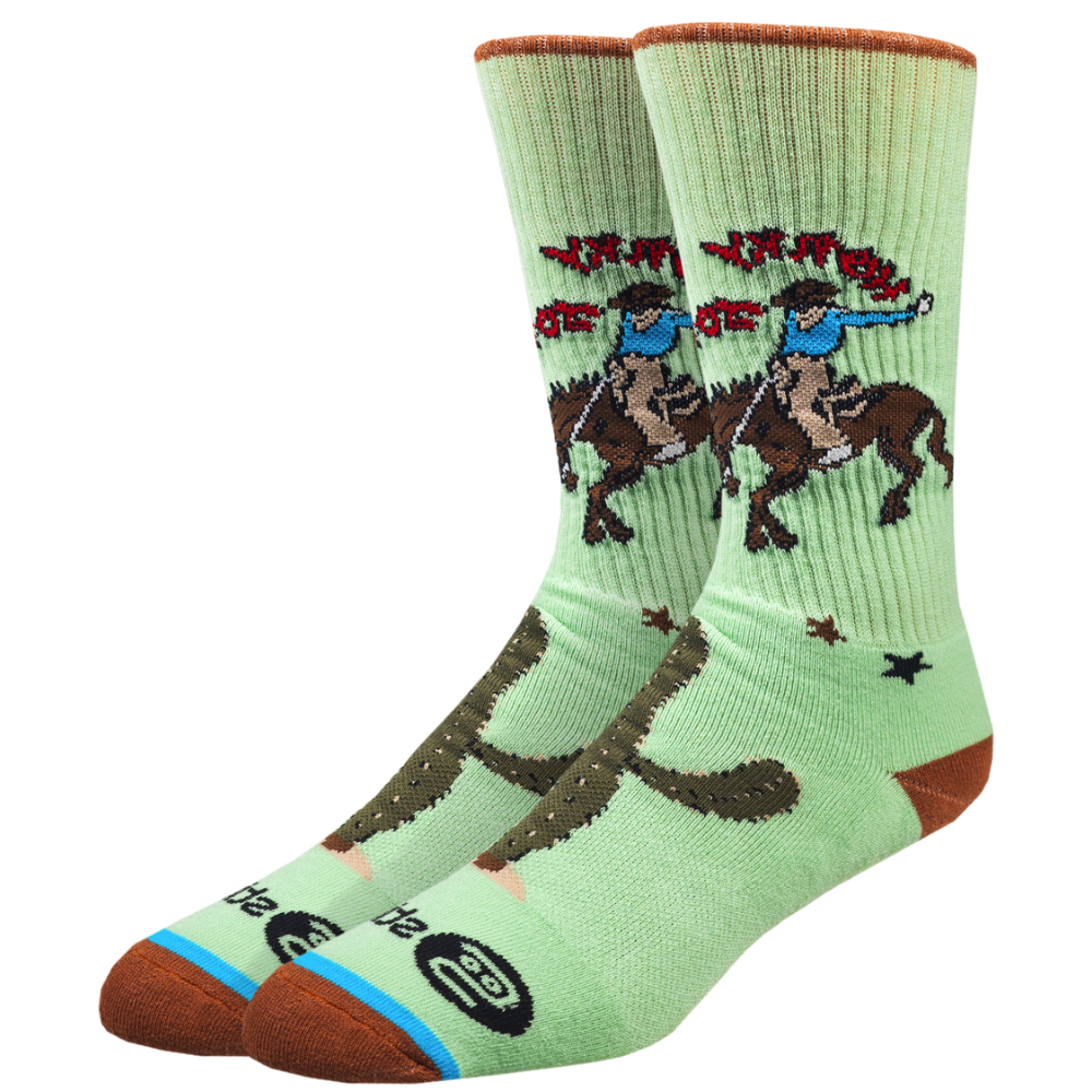 Light green socks with horse and rider design on a white background