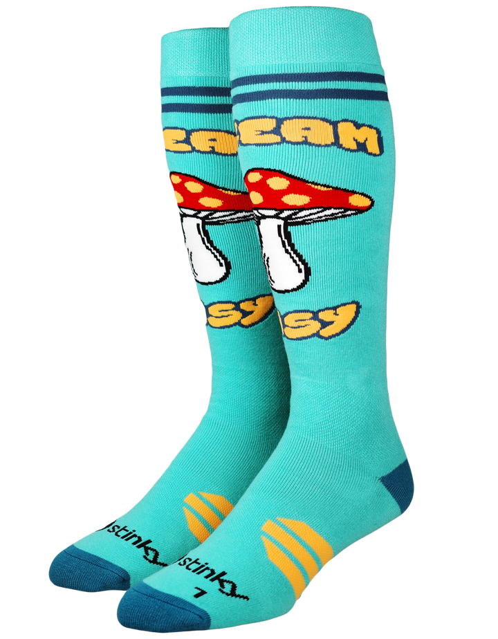 A pair of Stinky Stinky knee-heigh socks in a bright turquoise blue color, featuring a red and white mushroom graphic with the words 'DREAM EASY' in yellow. The socks also feature the Stinky Stinky brand logo near the toes and yellow striped accents on the feet.
