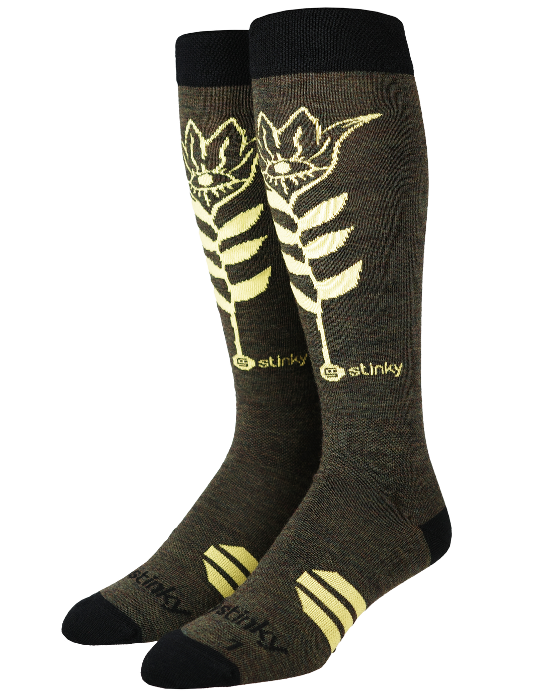 A pair of dark olive brown knee-high socks with a cream-colored stylized fern leaf graphic and the brand name 'stinky' printed near the calf, shown on a plain white background.